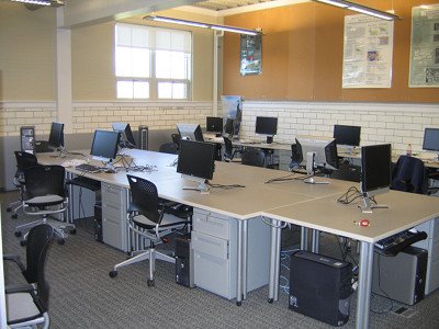 This image shows the lab space available to the GeoTREE Center, with multiple Dell computers set up in rows. 